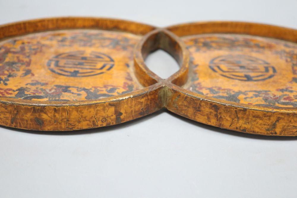 A 19th/20th century Chinese double circular wood and lacquer tray, length 42cm